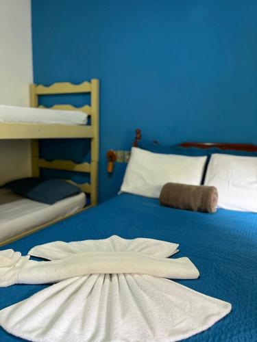 Ένα ή περισσότερα κρεβάτια σε δωμάτιο στο Buena Onda Suites