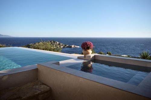 a swimming pool with a view of the ocean at Orfos Villas in Agios Nikolaos