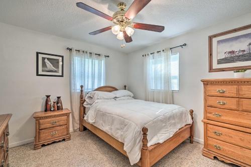 a bedroom with a bed and a ceiling fan at Satchell's Lakehouse in Inverness