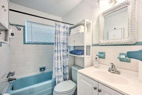 a bathroom with a sink and a toilet and a mirror at Satchell's Lakehouse in Inverness