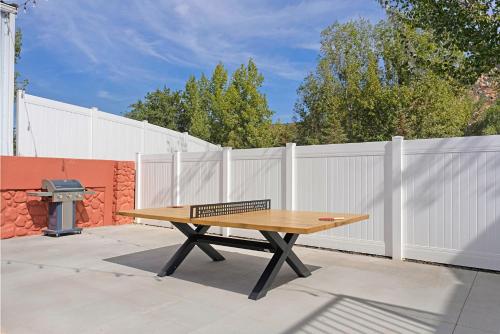 a picnic table in front of a white fence at The Silver Spur in Hildale