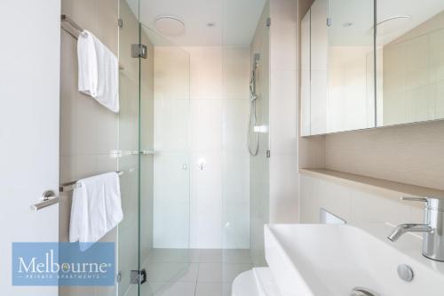 a bathroom with a shower and a sink at Melbourne Private Apartments - Collins Wharf Waterfront, Docklands in Melbourne