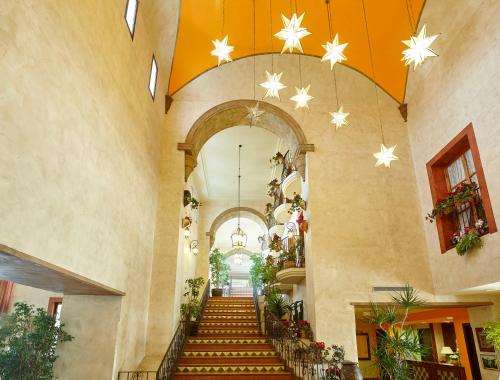 a hallway with stairs in a building with stars on the ceiling at PortAventura Hotel El Paso - Includes unlimited access to PortAventura Park & 1 access to Ferrari Land in Salou