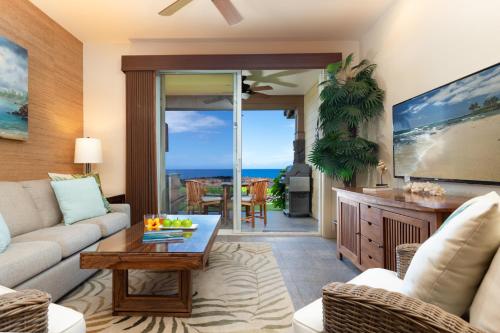 a living room with a couch and a table at 14B Halii Kai in Waikoloa