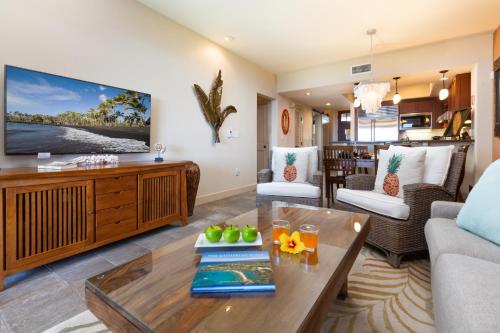a living room with a couch and a table at 14B Halii Kai in Waikoloa