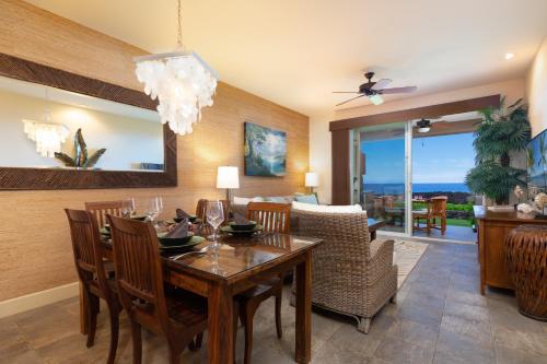 a dining room with a table and chairs at 14B Halii Kai in Waikoloa