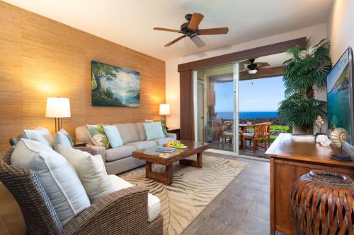 a living room with a couch and a table at 14B Halii Kai in Waikoloa