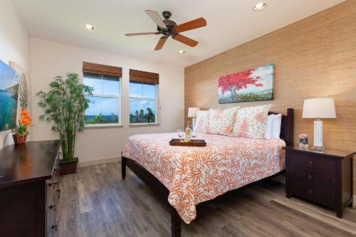 a bedroom with a bed and a ceiling fan at 14B Halii Kai in Waikoloa