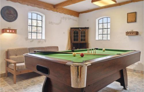 a billiard room with a pool table in it at Nice Apartment In Dannemare With Sauna in Dannemare