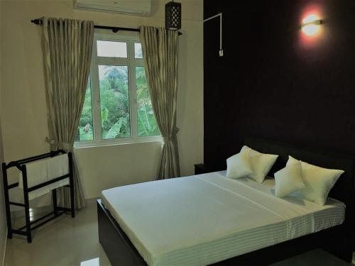 Ένα ή περισσότερα κρεβάτια σε δωμάτιο στο Superior Villa near Colombo Airport