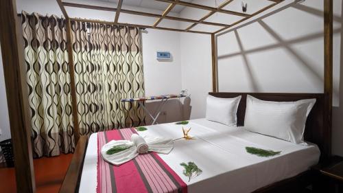 Ένα ή περισσότερα κρεβάτια σε δωμάτιο στο Mango tree view holiday house