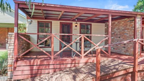 a porch of a house with a wooden deck at Tasman Holiday Parks - Merool on the Murray in Echuca