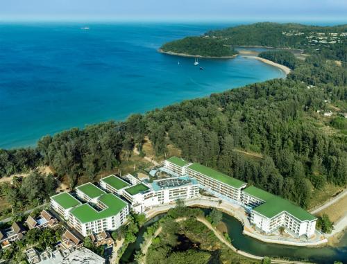 an aerial view of the resort and the water at Kora Beach Resort Phuket in Bang Tao Beach