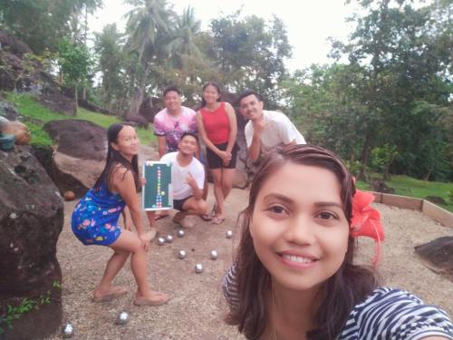 a group of people playing a game of golf at ecoco rocks in Sibulan