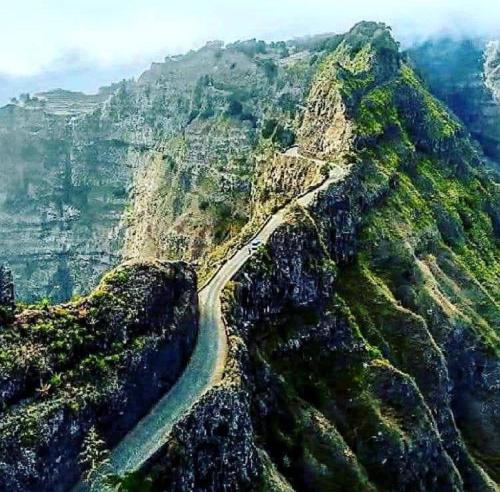 a winding road on the side of a mountain at Residencial Oliveira in Porto Novo