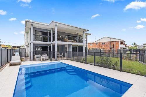 an image of a house with a swimming pool at 3 Seacrets at Shelly in Urangan