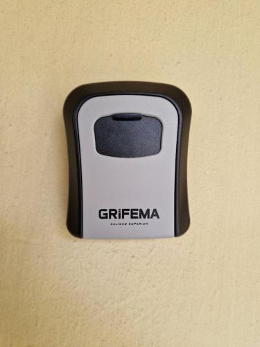 a black and white object on a wall at Bagnuz's Home in Scandicci