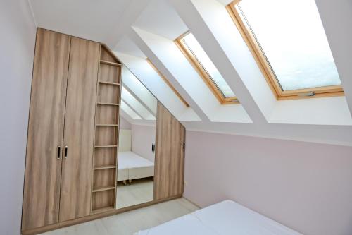 Posteľ alebo postele v izbe v ubytovaní Apartamenty Pod Skrzycznem