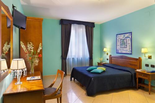 Una cama o camas en una habitación de Ulisse Deluxe Hostel