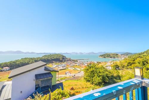 a view of the ocean from the balcony of a building at Namhae Moonlight 2gram Pool Villa Pension in Namhae