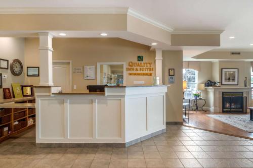 a large lobby with a counter in a building at Quality Inn & Suites Amsterdam in Fredericton