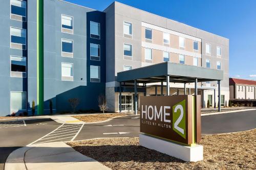 a home sign in front of a building at Home2 Suites By Hilton Hendersonville in Hendersonville