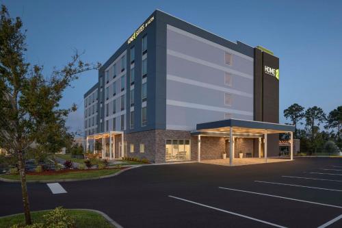 a rendering of a hotel with a parking lot at Home2 Suites By Hilton Sanford Orlando North in Sanford