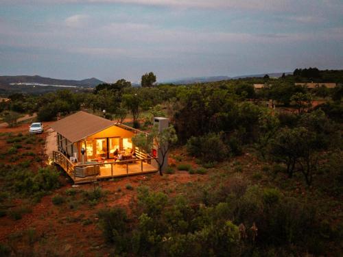 a house in the middle of a field at AfriCamps at Milorho in Rustenburg
