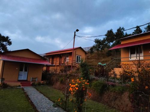 a row of houses with flowers in front of them at Into the mountain in Pokhara
