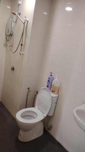 a bathroom with a toilet and a sink at Vista Alam 3 bedroom in Shah Alam
