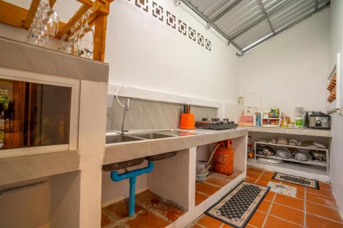 a kitchen with a sink and a counter at Angkor Rithy Residence team in Siem Reap