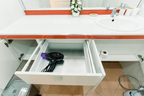 a drawer in a bathroom with a sink at Luxury 4BR Apartment with Pool behind Alona Beach in Panglao