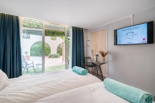 Postel nebo postele na pokoji v ubytování Mercure Antibes Sophia Antipolis