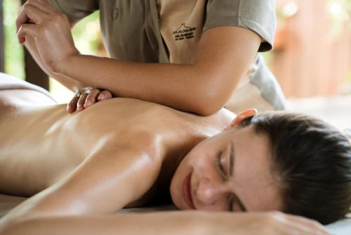 a man getting a massage from a therapist at Silavadee Pool Spa Resort - SHA Extra Plus in Lamai