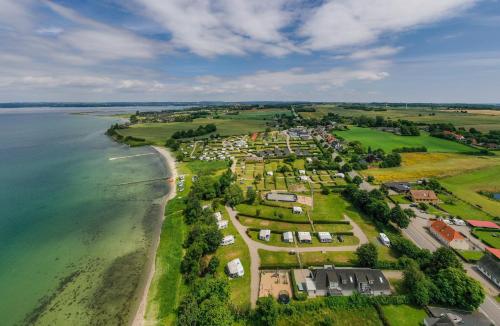 an aerial view of a resort next to the ocean at First Camp Bøjden Strand in Faaborg