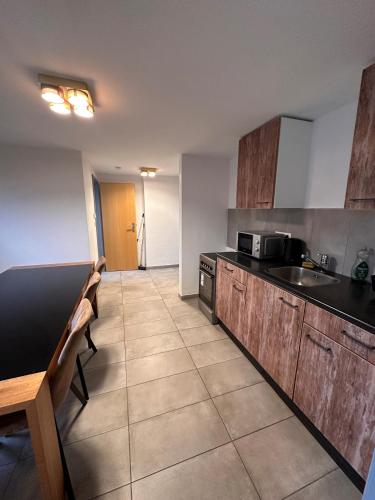 Kuchyň nebo kuchyňský kout v ubytování AM Apartment Sud20