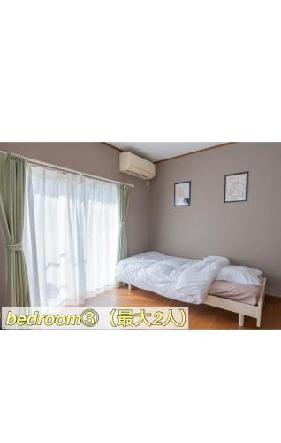 Katil atau katil-katil dalam bilik di TokonameINN HITOTOKI
