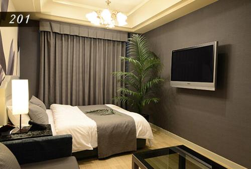 Hotel Ayung 大人専用にあるテレビまたはエンターテインメントセンター