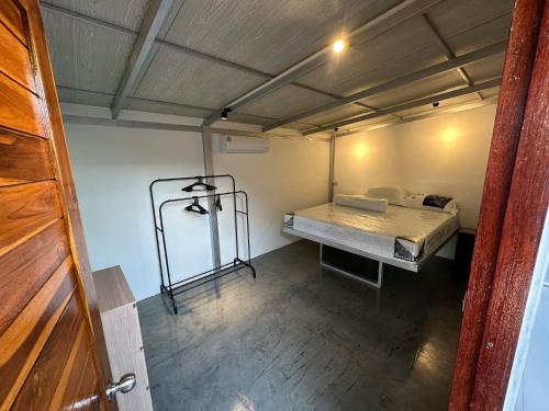 a room with a bed and a bed frame in it at 4 - Private Villa 2BR 1000mbps Wi-Fi in Wok Tum