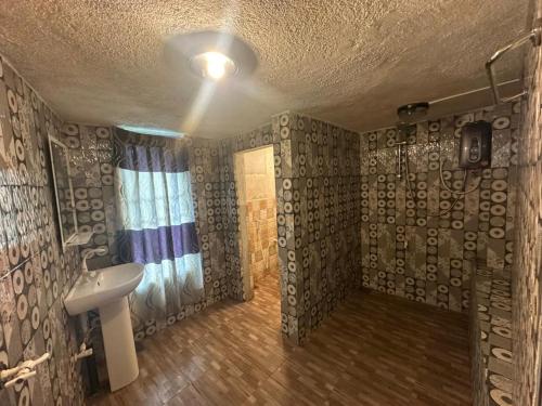 a bathroom with a sink and a shower at Green view Kandy in Kandy