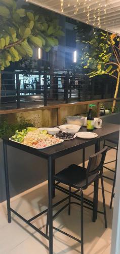a table with plates of food on it at Ayesha Metrocity Staycation N-02 & N-5-03 in Kuching