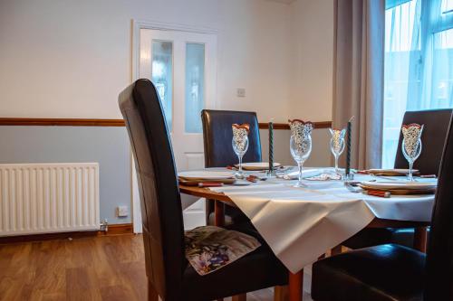 a dining room with a table and chairs at Spacious 4-Bed Home in Wetherby in Wetherby
