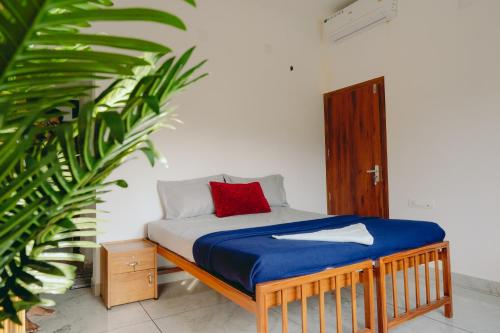 Ένα ή περισσότερα κρεβάτια σε δωμάτιο στο Lilliput Haven Homestay
