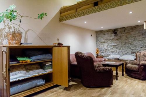 a living room with a couch and a chair at Parlament in Tallinn
