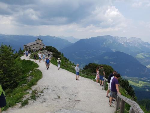 a group of people walking down a path on a mountain at Alpenschwänchen 4 - Saalachschwänchen in Bad Reichenhall