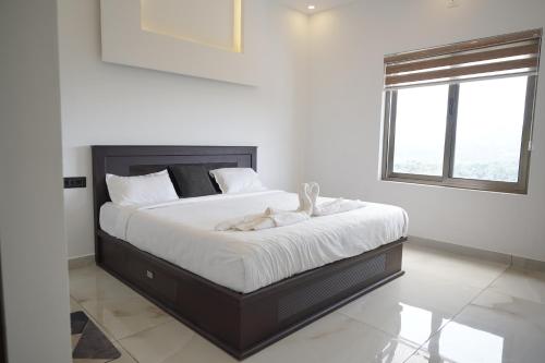 Una cama o camas en una habitación de Highrange Villas