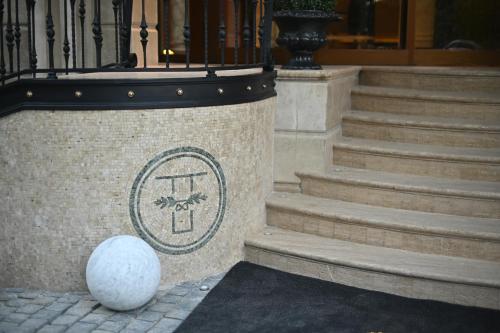 a building with a staircase with a sign on it at The Townhouse Hotel - Small Luxury Hotels of the World in Islamabad