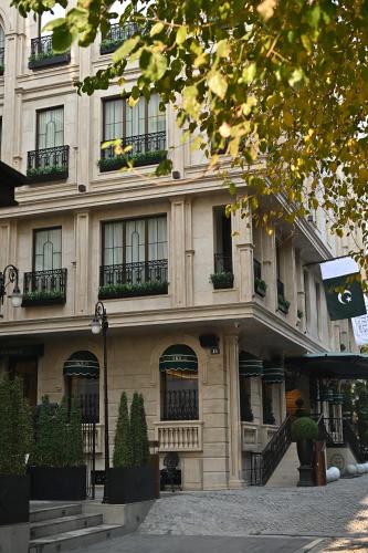 a large building with windows and balconies on a street at The Townhouse Hotel - Small Luxury Hotels of the World in Islamabad