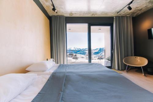Postel nebo postele na pokoji v ubytování Quadrum Hotel