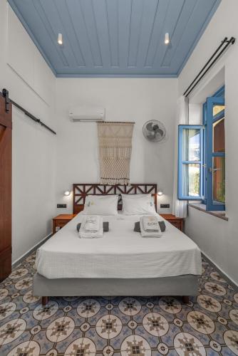 a bedroom with a large bed in a room at Casa del Sol Suites in Rhodes Town